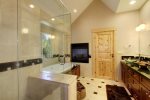 Master Bath with shower and large jetted soaking tub.